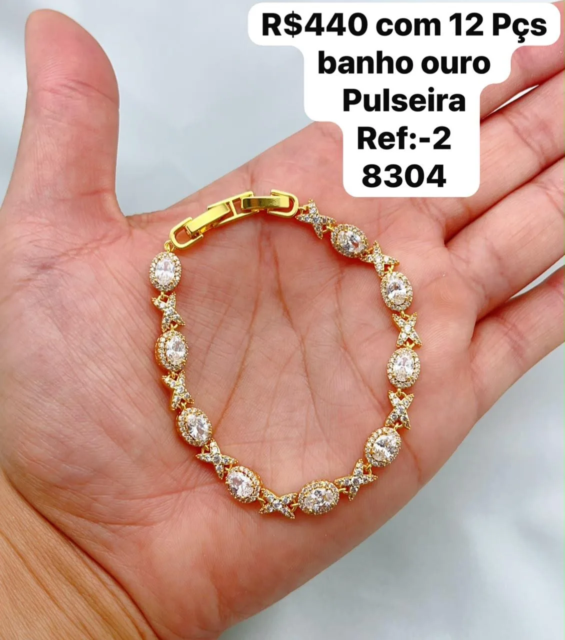 pulseira com pedras ovaladas e detalhes em X